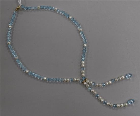 A single strand blue topaz and freshwater pearl tassel drop necklace with 18ct gold clasp, approx 58cm.